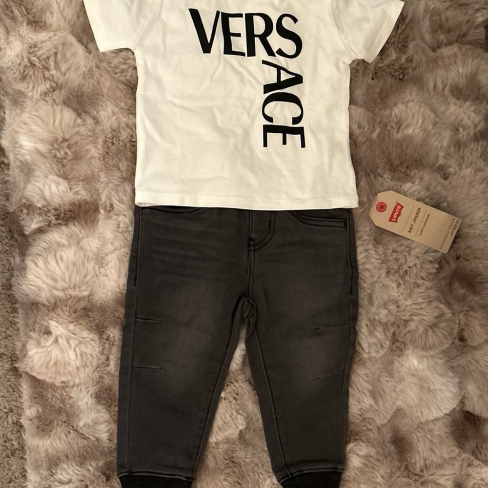 Versace shirt and Levi’s pants